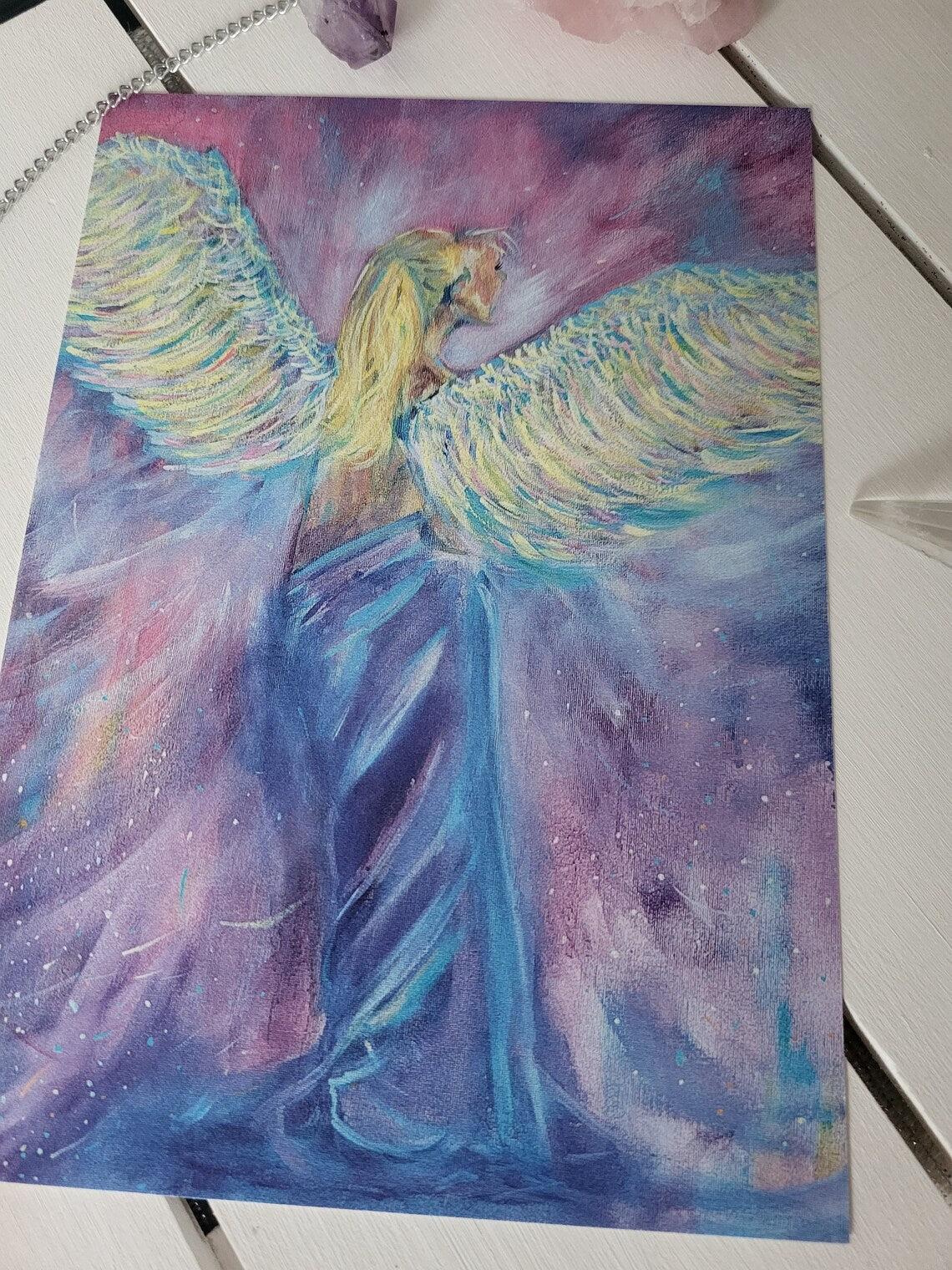 An A5 giclee fine art print of an angel painting on a pink and purple background created by Emmalouise Black