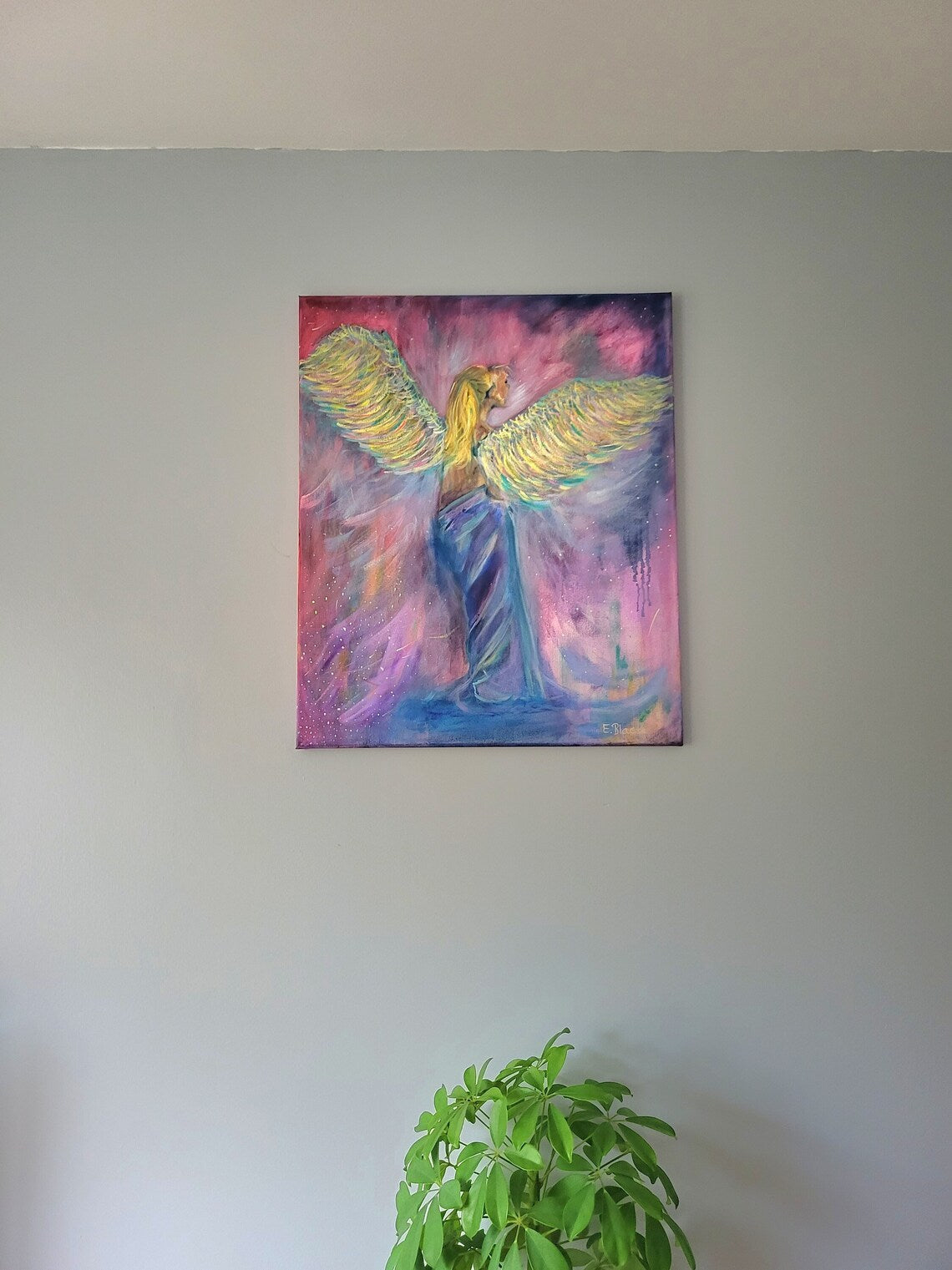 Oil painting of a whimsical angel with blonde hair and golden wings on a pink background.