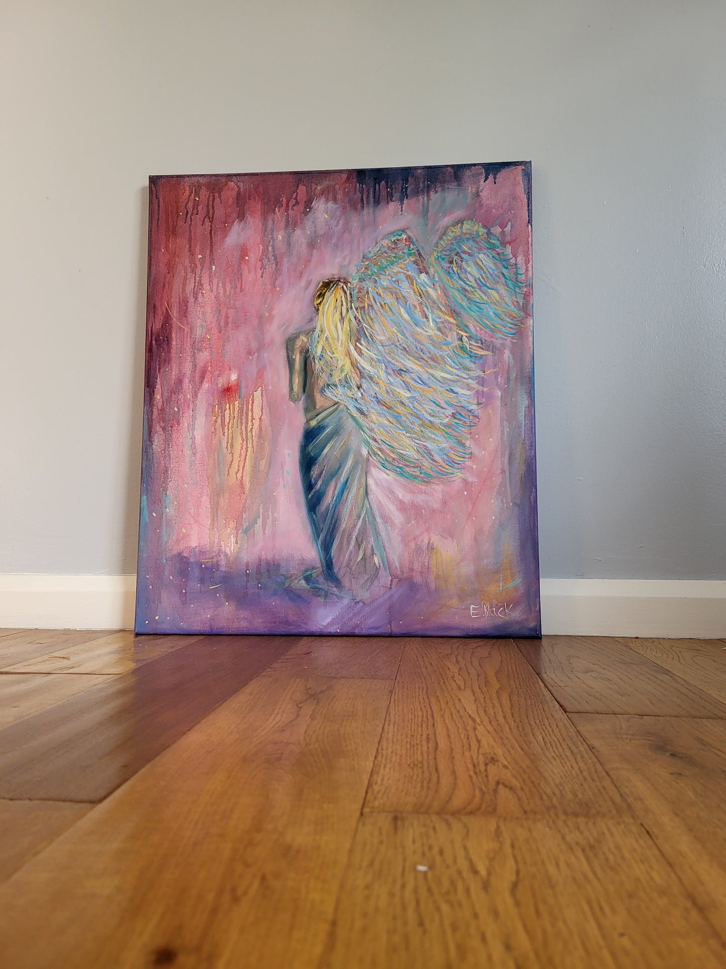Oil painting of a female figure angel with multicoloured wings on a pink and purple background.